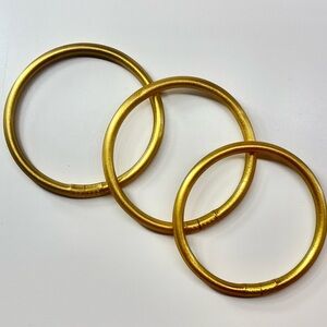 Set of three golden bracelets